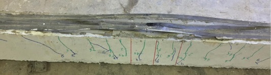 Cracking pattern and debonding of CFRP strips at failure for beam B-S-4.