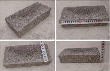 Brick masonry made of industrial solid wastes, cement, and water.