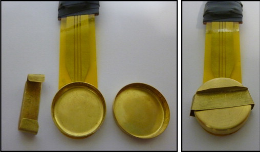 Gold container glued to a TPS sensor for specific heat measurements. The open ...