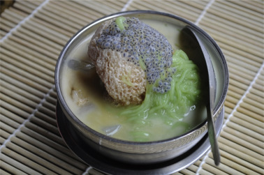 Nyonya chendol. A mixture of crushed ice, coconut milk, palm sugar, ...