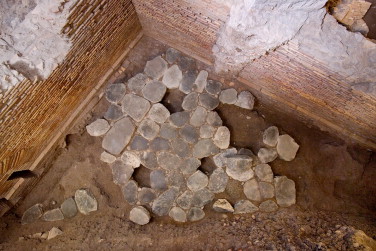 Palazzo Valentini, area along via di S. Eufemia, the domus: basalto slabs.